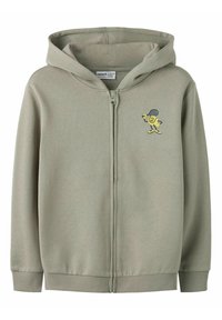 Hoodie med glidelås i lys grønt stoff, med et gult animert karakterdesign på venstre bryst, med ribbestrikkede mansjetter og kant.
