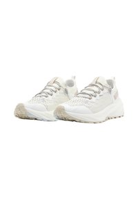 Chaussures de course légères en maille beige clair avec des accents texturés. Dotées d'une semelle rembourrée et d'un système de laçage flexible.