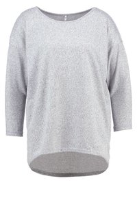 Grå långärmad tröja med rund halsringning, mjuk textur och rundad nederkant. Har en avslappnad passform och sömlösa detaljer på ärmarna.