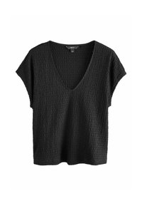 Top corto nero con texture, maniche corte, scollo a V profondo e vestibilità morbida, posizionato su uno sfondo bianco.