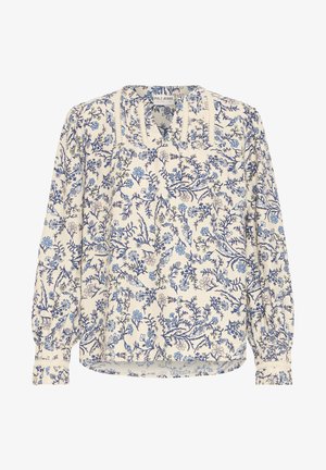 Kreemist ja sinistest mustritest koosnev pikka varrukat omav lilleline pluus. Omab kokku tõmmatud kaelaosa ja elastseid mansette, valmistatud kergest tekstuurilisest kangast.