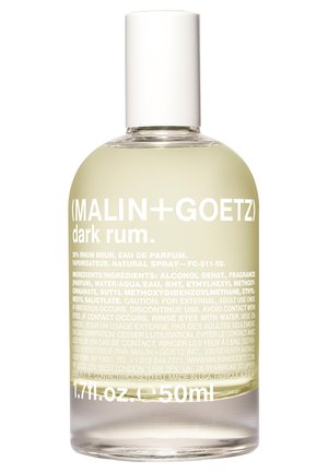 Clear glass bottle with a rounded shape. White cap. Label includes brand name, product type, and ingredient details in white text on a transparent background.