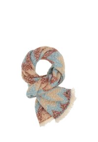 Scarf morbido e spesso con un motivo a zigzag nei colori beige, blu e ruggine, annodato in modo sciolto con bordi frangiati.