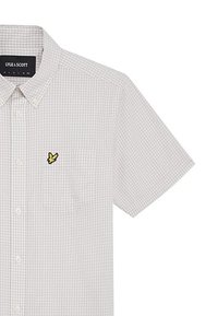 Camicia a maniche corte grigia chiara a quadratini con colletto button-down, dotata di una tasca sul petto e di un emblema di un uccellino giallo sul lato sinistro.