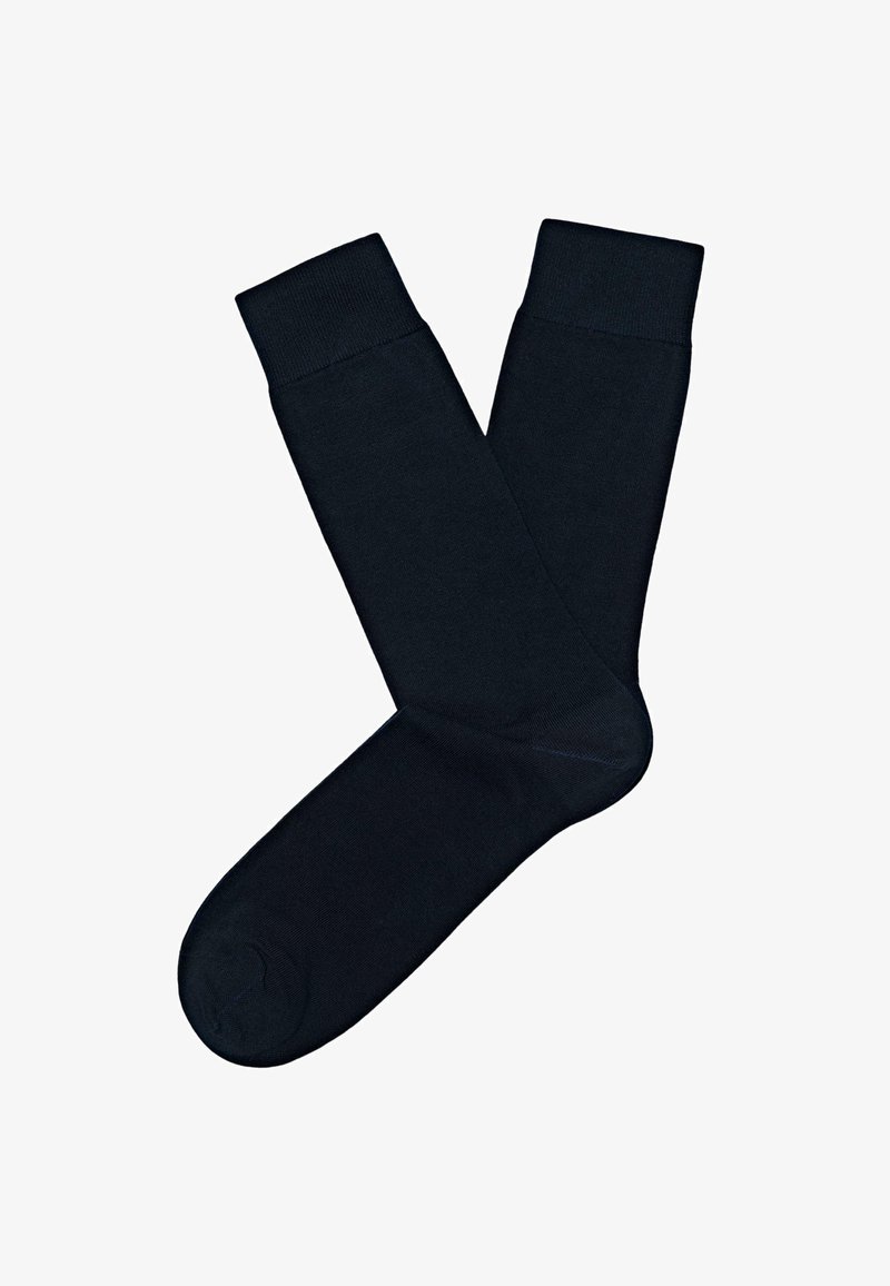 Czarne bawełniane skarpetki z prążkowanymi ściągaczami, o gładkiej fakturze i prostym, klasycznym designie. Odpowiednie na co dzień oraz na uroczyste okazje.