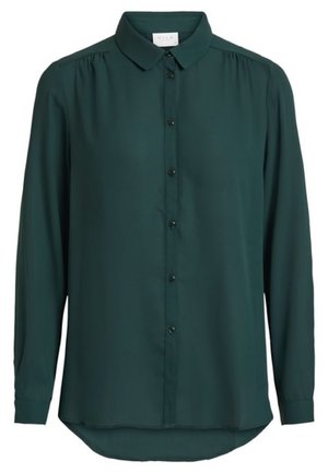 Donkergroene blouse met lange mouwen, knopen, kraag en lichte plooien op de schouders.