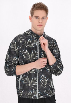 Sort zip-up jakke med hætte, prydet med et grønt og blåt bladmønster. Fremstillet af letvægts, tekstureret materiale.