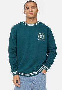 Karl Kani RETRO EMBLEM COLLEGE CREW  - Sportinis megztinis - teal white