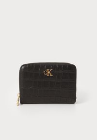 Black crocodile-patterned zip wallet with gold cK logo and gold zipper pull on a white background.