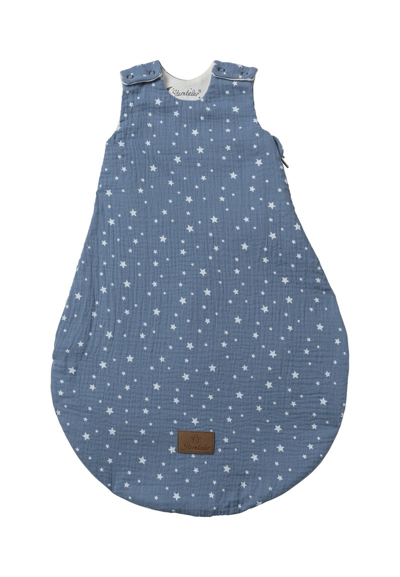 Blue cotton baby sleeping bag with white star pattern, round bottom, snaps at shoulders, and a textured finish. Brown brand label visible.