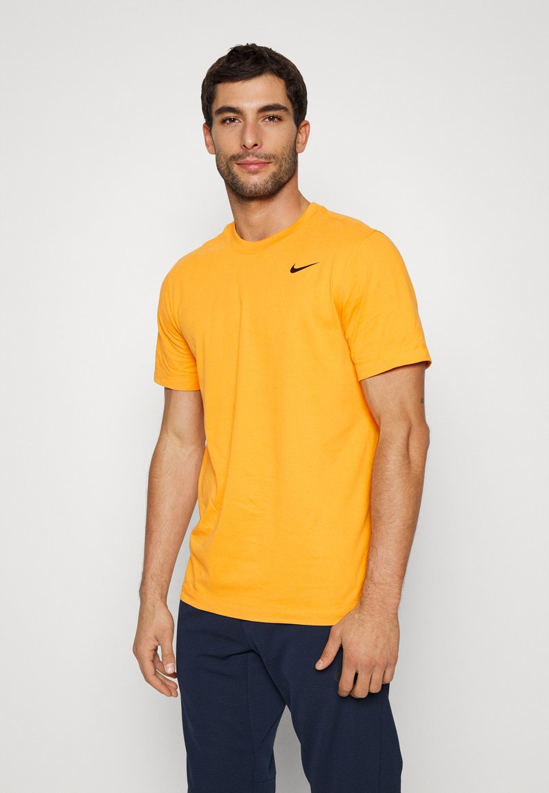 Nike Performance CREW SOLID - T-shirt desportiva - kumquat/black