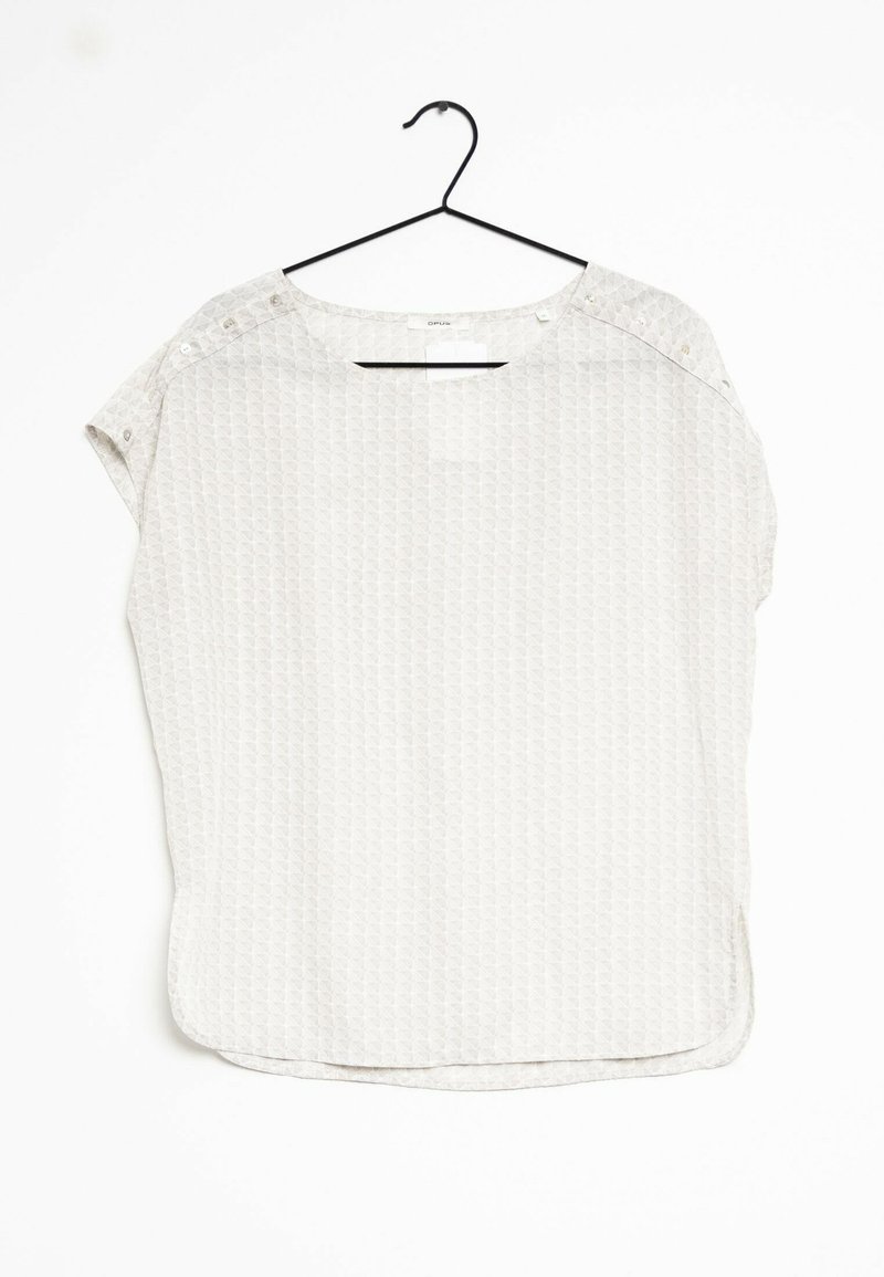 Top grigio chiaro a maniche corte con motivo geometrico, scollatura rotonda e dettagli con bottoni a pressione sulla spalla. Tessuto leggero.