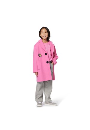 Pink wool blend coat with a notched collar, two black buttons, and floral embroidery on the left side, paired with gray jeans and sneakers.