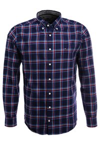 Camisa de cuadros azul marino con detalles en rojo y blanco. Cuenta con un cuello clásico y mangas largas con puños abotonados. Tela de algodón.