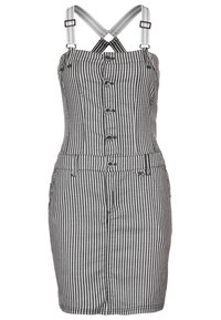 Gestreiftes Kleid mit verstellbaren Trägern, Knopfverschluss, tailliertem Oberteil und knielangem Rock aus schwarz-weißem Stoff mit strukturierter Oberfläche.