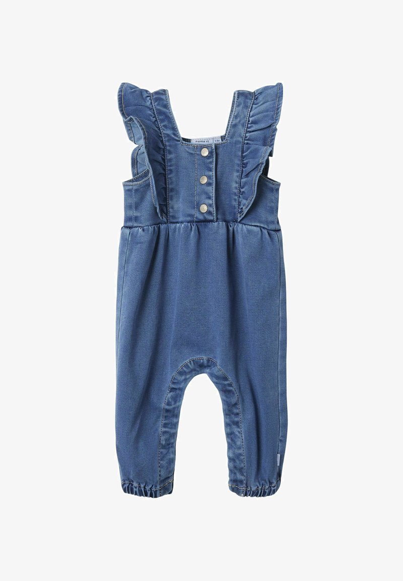 Denimo kombinezonas su sutrauktomis petnešomis, priekyje užsegamas mygtukais ir su susiraukusiu liemeniu. Spalva – vidutinė mėlyna, su elastingais kulkšniais.