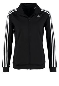 Veste zippée noire Adidas avec trois bandes blanches courant le long des manches longues et un petit logo Adidas sur la poitrine.