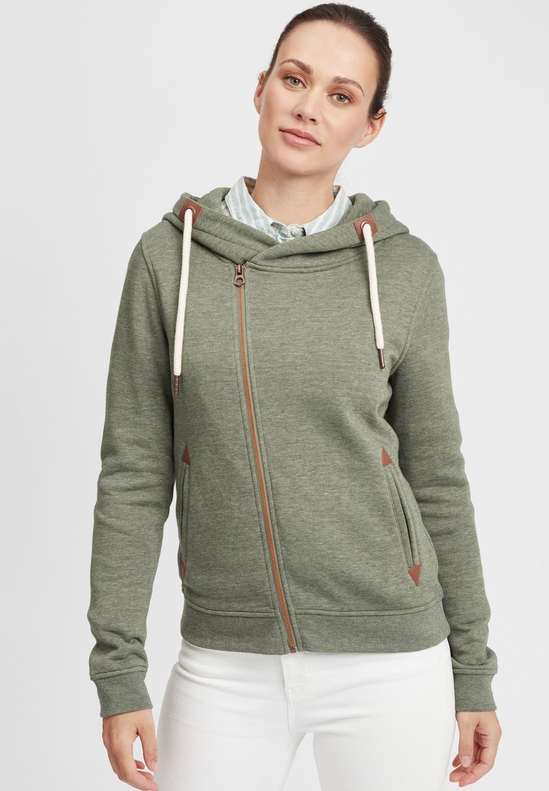 Green zip-up hoodie with a soft texture, featuring a front zipper, drawstring hood, and brown triangular accents on the sides.