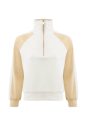 Pull-over à manches longues blanc et beige avec col montant et fermeture éclair à l'avant, comprenant des manches raglan beige et des poignets.