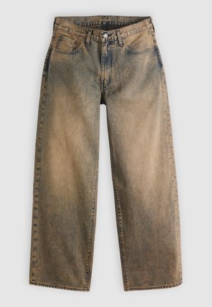 Vide denim jeans i en falmet brun farve med en lys vask. Har det traditionelle design med fem lommer og synlige sømdetaljer.