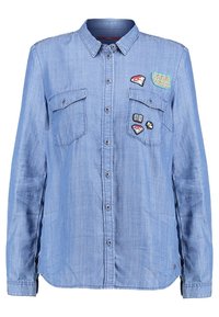 Camicia in denim azzurro chiaro a maniche lunghe con due tasche sul petto e colorati ricami, tra cui diamanti, un'ape e il testo "GOOD VIBES".