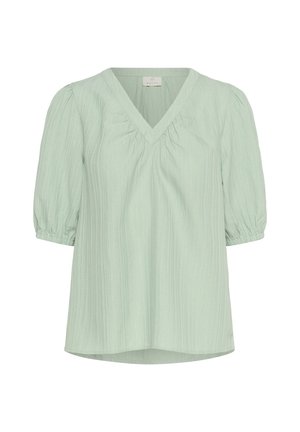 Hellgrüne, kurzärmelige Bluse mit V-Ausschnitt, gerafftem Bust und strukturiertem Stoff. Ballonärmel mit elastischen Bündchen. Lässiges Design.