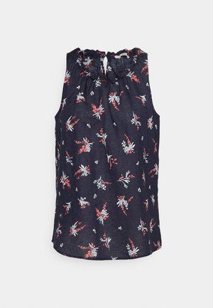 Mouwloze marineblauwe blouse met een bloemenprint in rood en wit, met een gerimpelde halslijn en een keyhole-details aan de achterkant. Lichtgewicht stof.