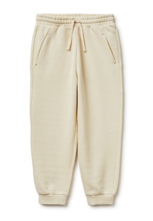 Beżowe dzianinowe spodnie dresowe z elastycznym pasem, sznurkiem do regulacji, bocznymi kieszeniami i ściągaczami przy nogawkach, ułożone płasko na białym tle.