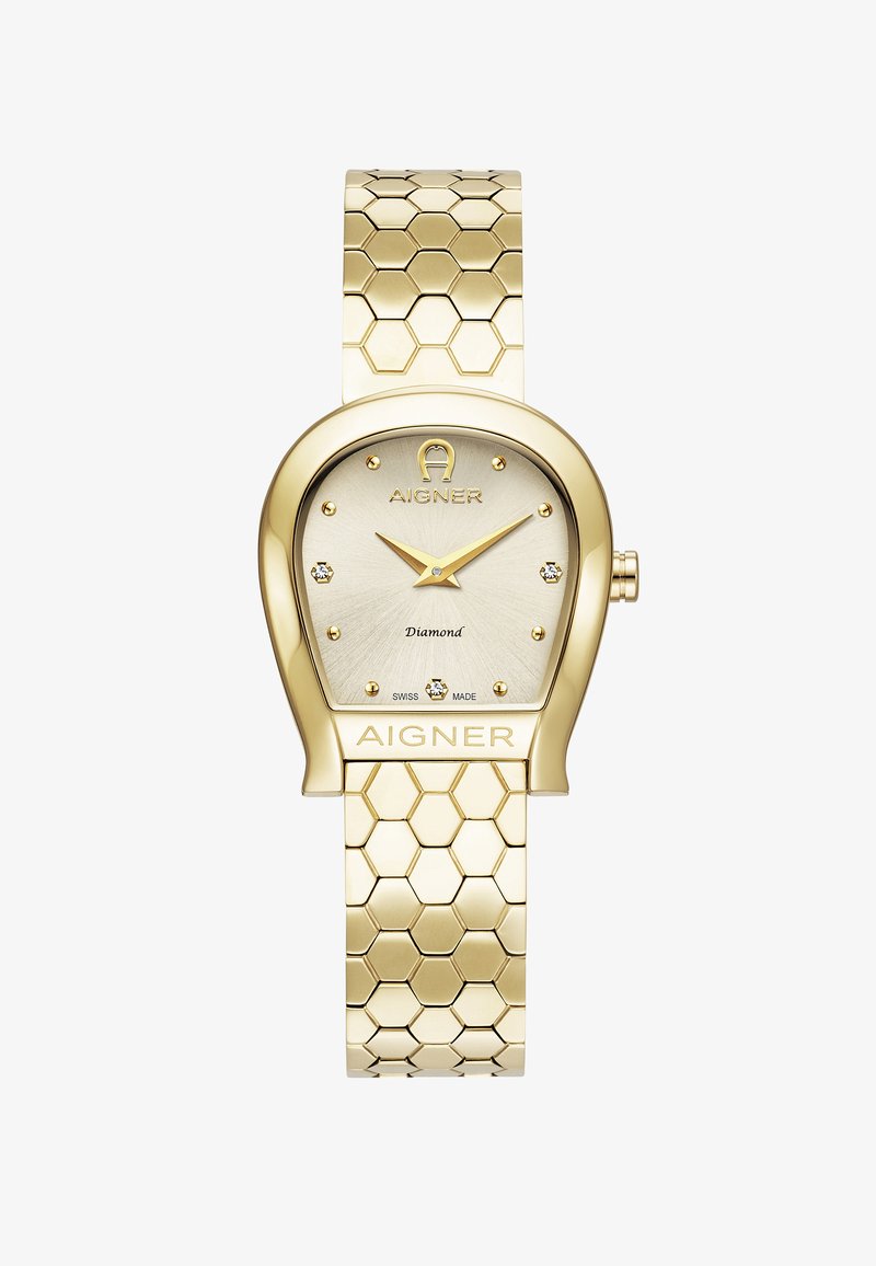Reloj en tono dorado con una correa de eslabones hexagonales, esfera ovalada y detalles con diamantes. Presenta una esfera de color claro y la marca AIGNER. Fabricado en Suiza.