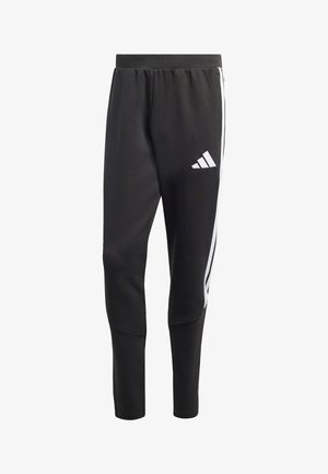 Pantalon de sport noir effilé avec taille élastique, bandes blanches sur les côtés et logo Adidas blanc sur la partie supérieure de la cuisse gauche.