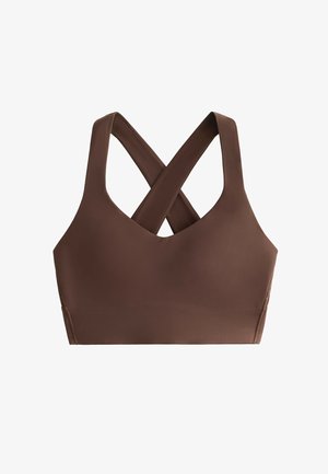 Bruine sportbeha met een V-halsontwerp en gekruiste banden aan de achterkant. Zachte, gladde stof en naadloze constructie voor comfort.