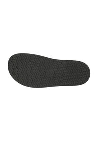 Semelle de chaussure noire avec un motif de semelle ondulé. Texture lisse, forme arrondie. Manque de marquages ou de logos visibles.