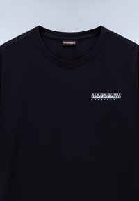 Black cotton t-shirt with a crew neck and short sleeves. Features a small white "NAPAPIJRI geographic" logo printed on the chest.