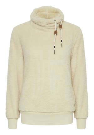Cream-colored fleece pullover with a high collar, drawstring accents, and ribbed cuffs and hem. Soft, textured fabric for warmth.
