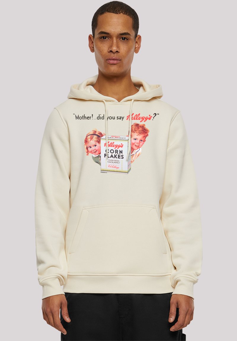Cream-colored hoodie with a front pocket, featuring printed retro Kellogg's Corn Flakes graphic and text, on a smooth, soft fabric.