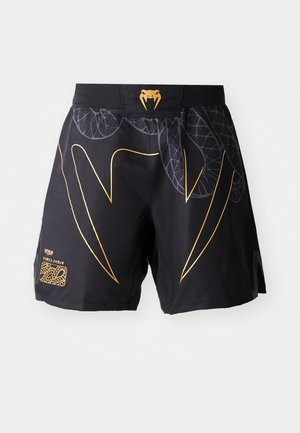Black athletic shorts with gold snake fang design, leaf patterns, and a gold snake head logo on the waistband against a white background.