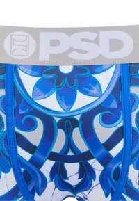Muške bokserice s plavim cvjetnim uzorkom na mekanom materijalu, sa sivim elastičnim pojasom u koji je utisnut "PSD" logo.