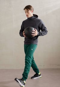 Champion ICONS CUFF PANTS - Treniņtērpa apakšdaļas - green