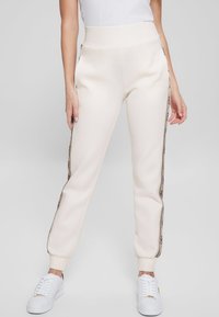 Guess - BRITNEY JOGGER - Tracksuit bottoms - bianco Thumbnail Image 1