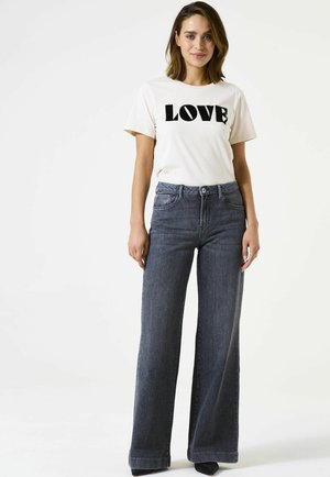 CELIA  - Flared Jeans - dark used