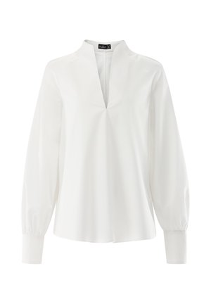 Weiße Bluse mit V-Ausschnitt, langen Puffärmeln und lockerem Schnitt. Hergestellt aus glattem Stoff, mit einem zentralen Nahtdetail.