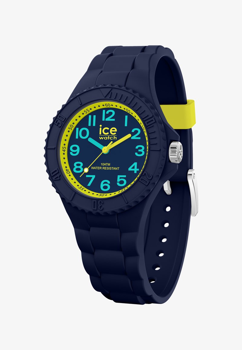 Niebieski silikonowy zegarek z okrągłą tarczą, żółtymi akcentami i wyraźnymi, łatwymi do odczytania cyframi. Wodoodporny do 10 ATM. Posiada koronę ze stali nierdzewnej.