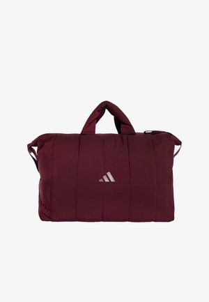 Borsa sportiva imbottita rettangolare color amaranto con manici corti e logo Adidas al centro davanti su sfondo bianco.