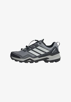 Gray hiking shoe with black accents and three white stripes. Features a mesh upper, textured surface, and a rugged, treaded outsole.