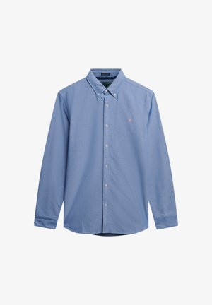 Camicia azzurra chiara con tessuto testurizzato, maniche lunghe e colletto. Presenta un piccolo logo sul petto sinistro.