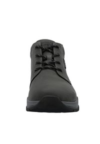 Black lace-up shoe with a smooth, matte upper, contrasting stitching, rounded toe, rubber sole, and minimalistic design.