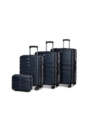 Four navy hardshell suitcases with textured stripes, varying sizes. Features extendable handles and smooth-rolling wheels.