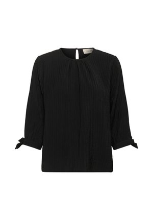 Blouse noire texturée avec des manches 3/4, décolleté rond, fermeture à bouton clé au dos et petits poignets noués.