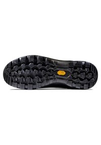 Semelle en caoutchouc noir avec un motif de bande de roulement robuste comportant des crampons hexagonaux et un logo Vibram en jaune. Texture lisse, conçue pour l'adhérence.