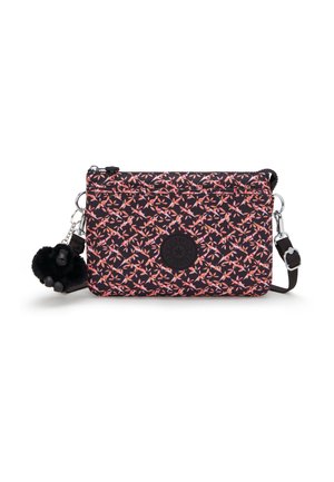 Rectangular fabric bag with a black background, floral pattern in pink and orange, logo patch, and a detachable black fur pom-pom keychain.